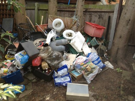 Rubbish removal team clearing waste in North West London